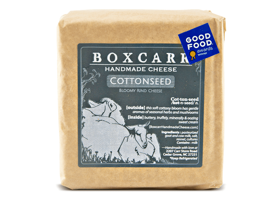 Boxcarr cottonseed handmade cheese wrapped in paper with a gray label